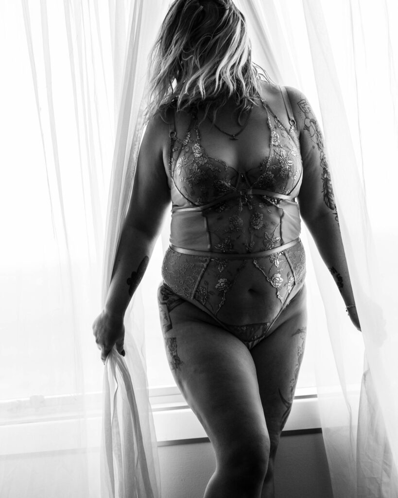 Woman standing in lace lingerie, boudoir portrait photography Warragul